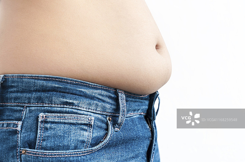 穿着紧身蓝色牛仔裤的女士腹部图片素材