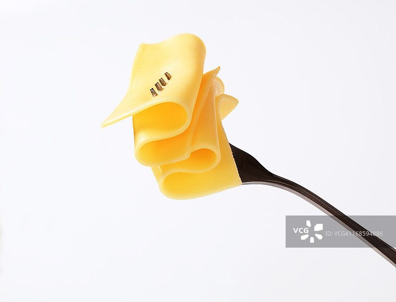 叉子上的奶酪片图片素材