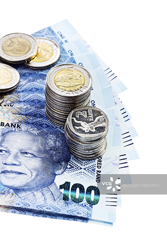 银币压住以曼德拉为主题的南非新钞图片素材