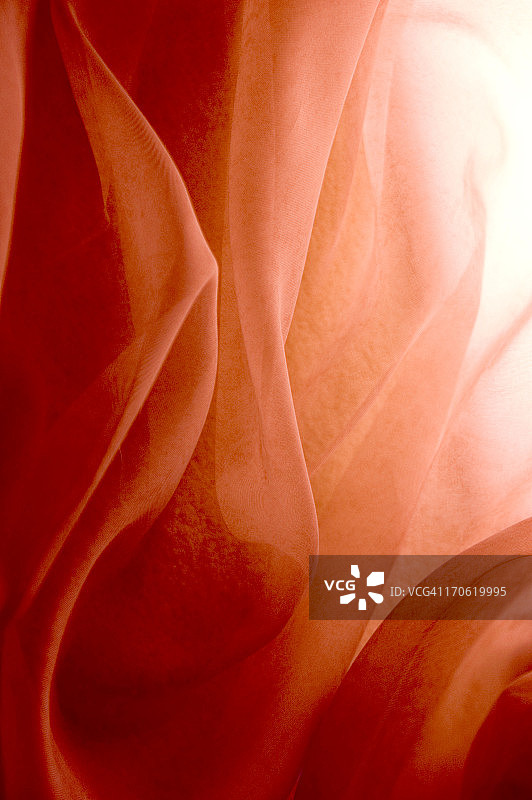 光芒穿透玫瑰色面料图片素材