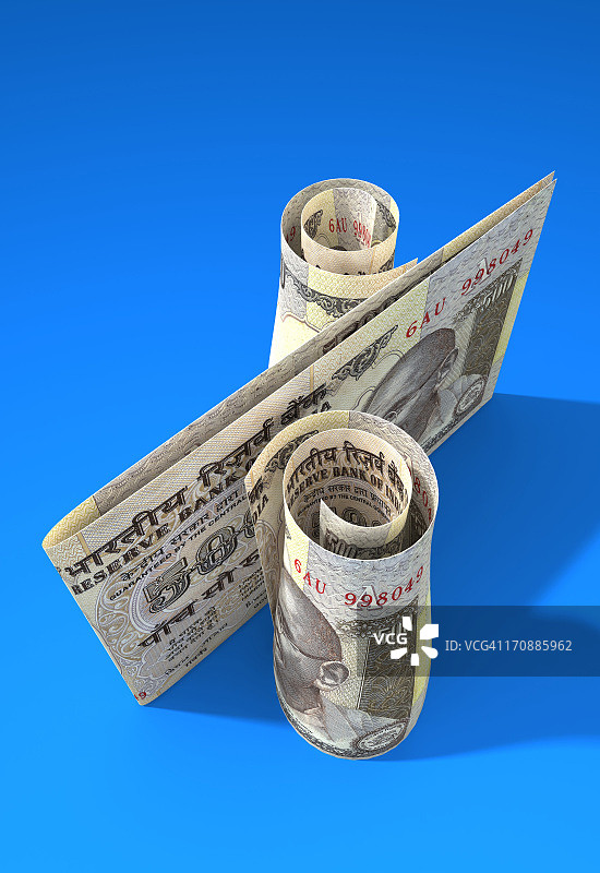 蓝色背景上的印度货币钞票特写图片素材