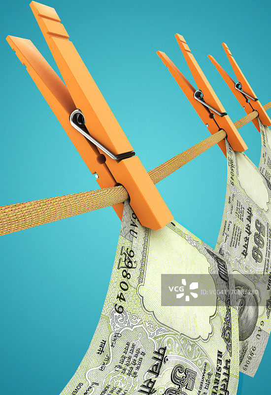 用绳子和晾衣夹悬挂货币，代表洗钱的概念图图片素材