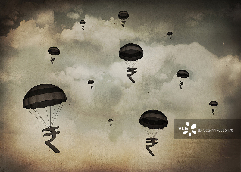 带着降落伞飘落的印度卢比群图片素材