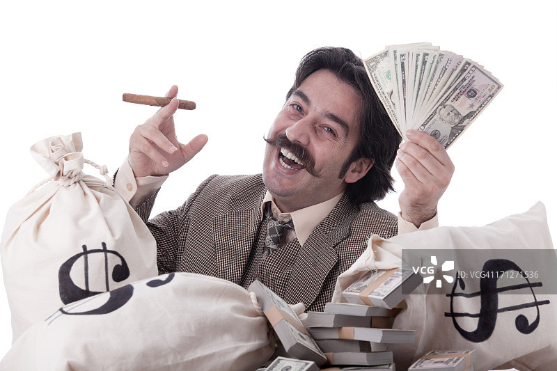 拿着钱袋和美元的富人图片素材