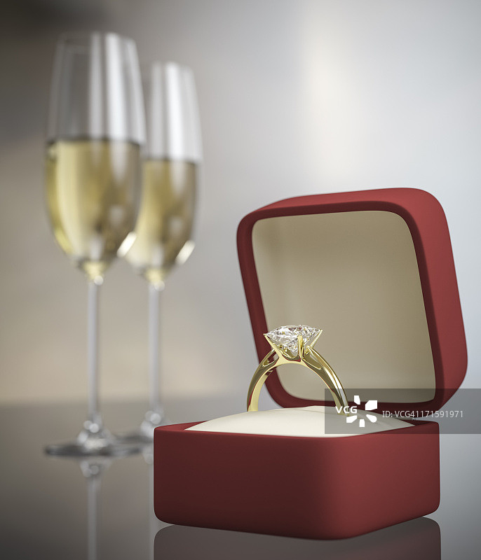 戒指和两杯葡萄酒的求婚概念图片素材