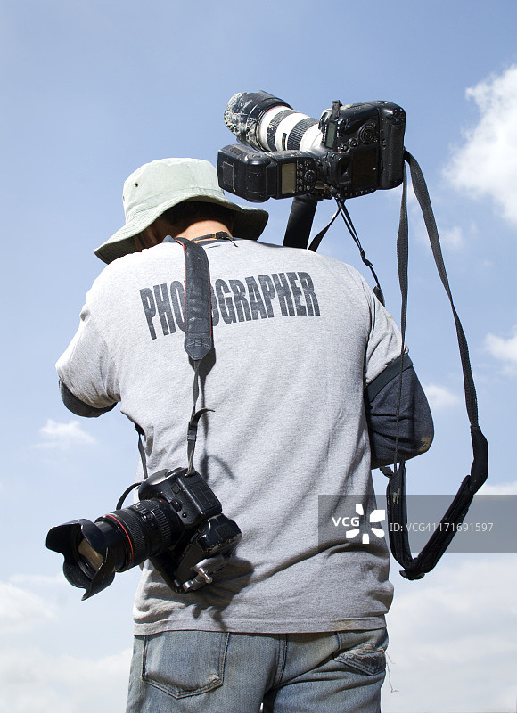 活动摄影师的背面图片素材