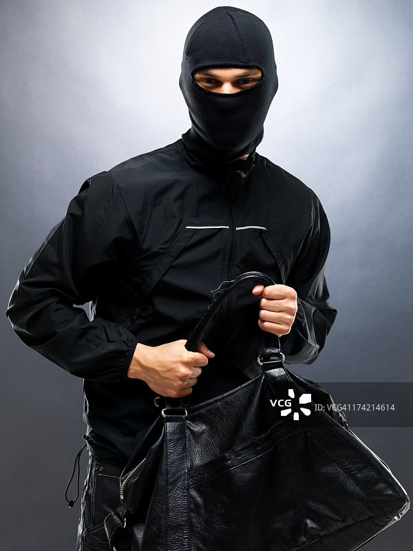 小偷盗窃手提包图片素材