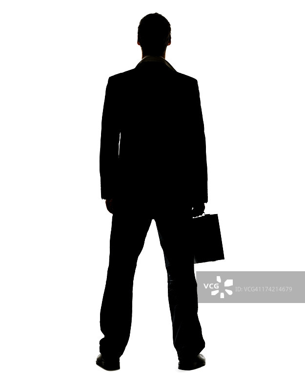 手提公文包站立的年轻商人图片素材