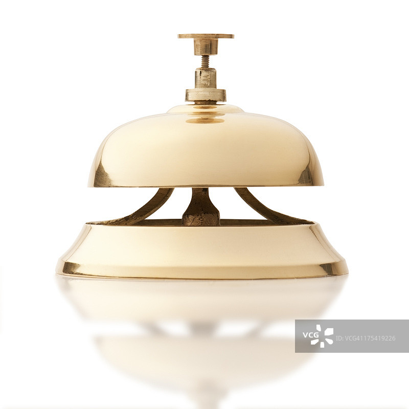 白色背景上的金色服务铃图片素材