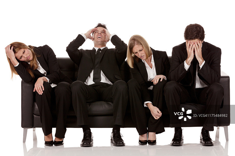 烦躁的商务人士坐在沙发上图片素材