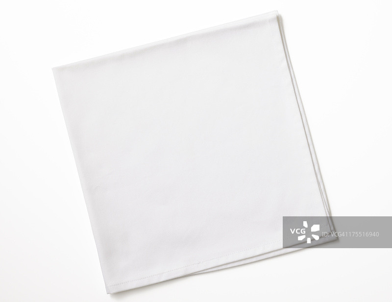 白色背景上折叠的白色餐巾图片素材