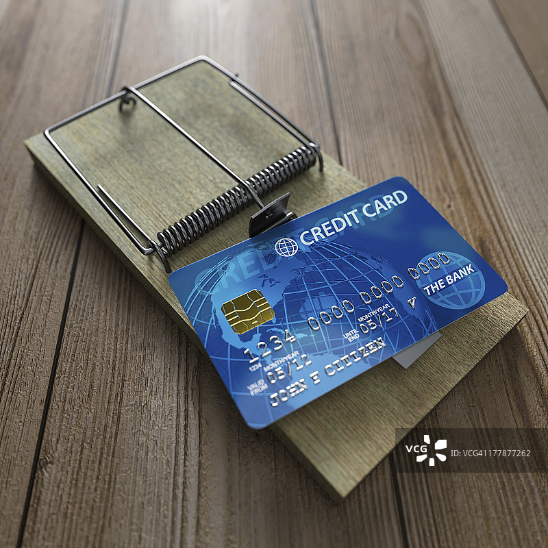 木地板上的信用卡捕鼠器图片素材