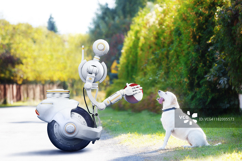 机器人拿着球准备和狗玩耍图片素材
