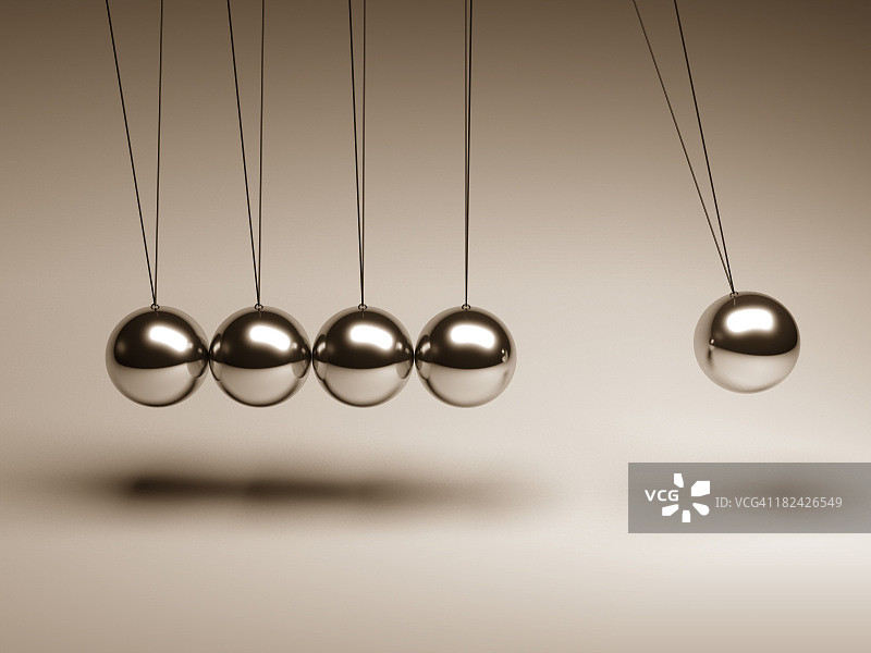 牛顿摆上用绳子串起来的银色球图片素材