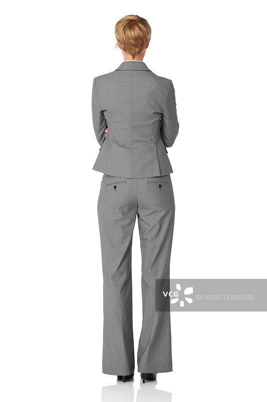 双手交叉站立的女商人背影图片素材