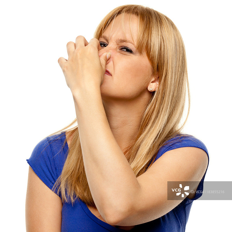 厌恶的女人捏着鼻子图片素材