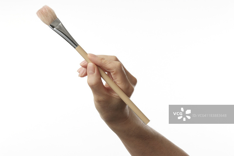 白色背景上的油漆匠工作的手图片素材