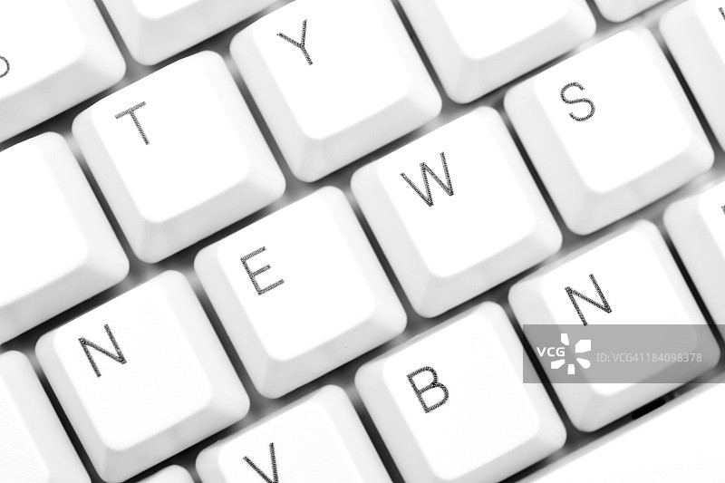 白色电脑键盘上的“新闻”字样图片素材