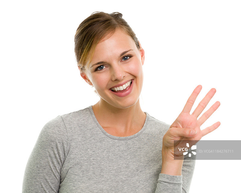 做出四指手势的年轻女人图片素材