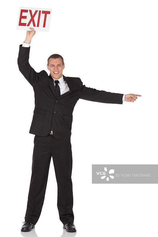 拿着“出口”标志牌的商人图片素材