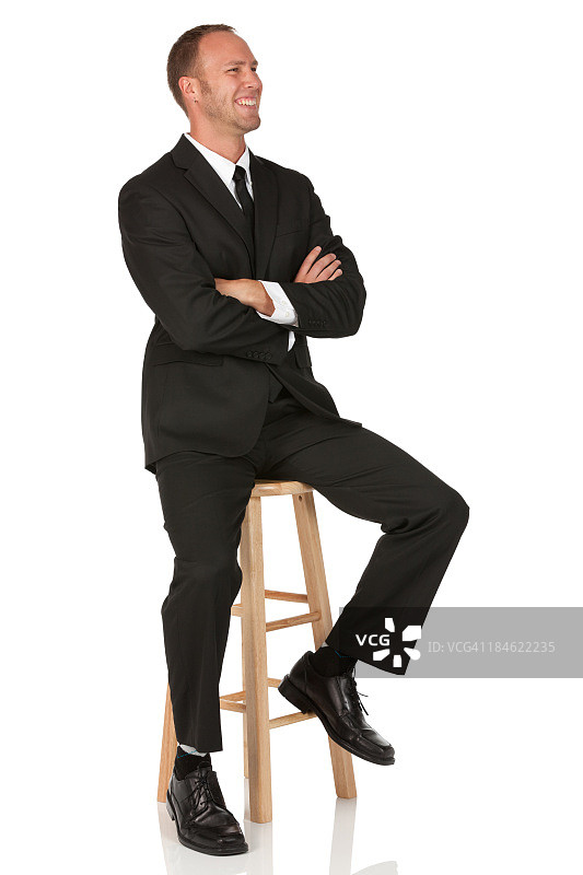 双臂交叉的快乐商人图片素材