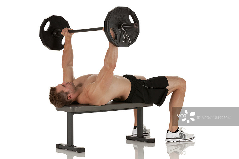 健壮男人举重侧写图片素材