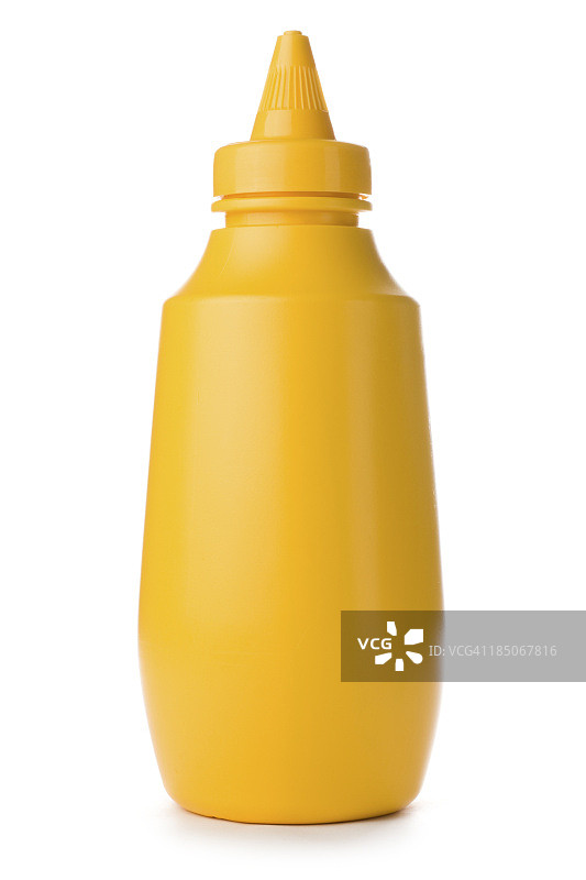 白色背景上的黄色芥末瓶特写图片素材