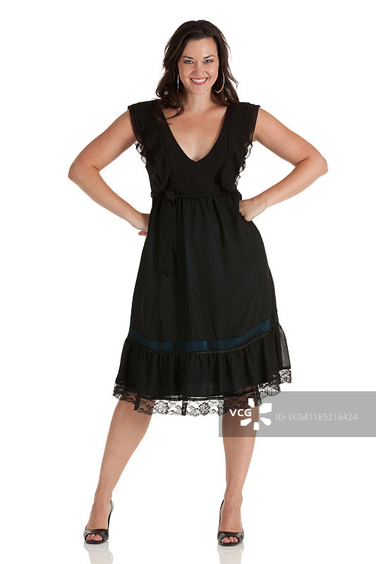 快乐美丽女人叉腰站立图片素材