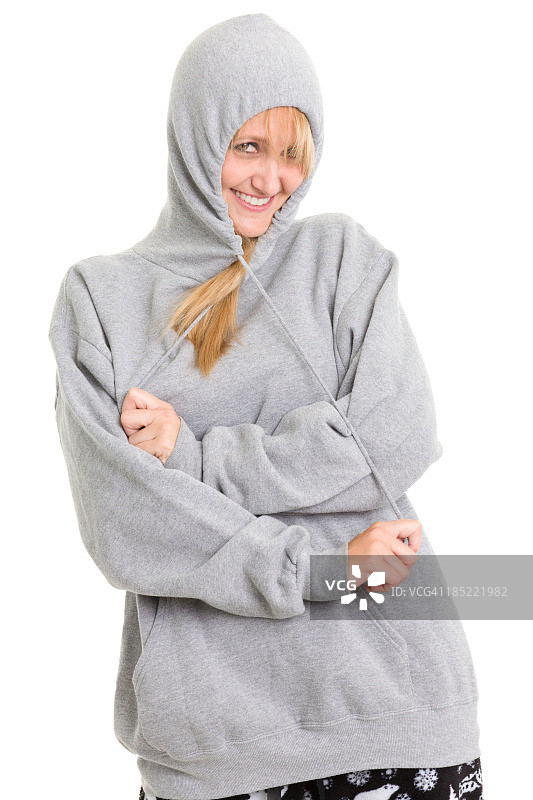 快乐的女人拉起运动衫的拉绳图片素材