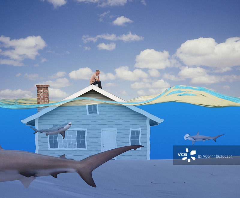 坐在水下房子上的男人图片素材