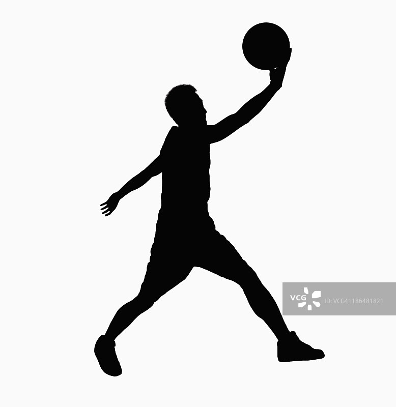 持球跳跃的篮球运动员剪影图片素材