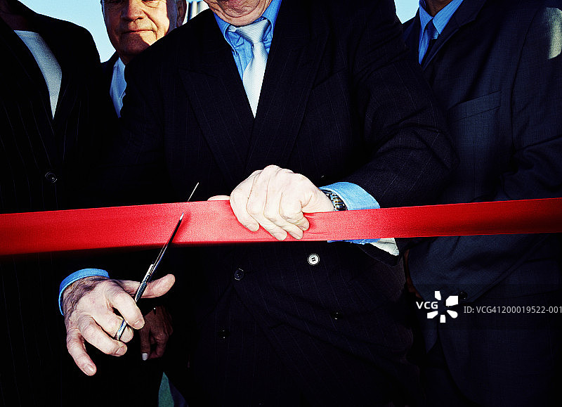 商人剪彩带，特写图片素材