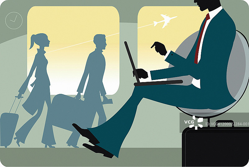 在机场使用笔记本电脑工作的商人图片素材