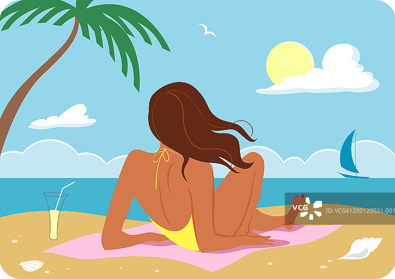 女人躺在沙滩上的毛巾上，后视图图片素材