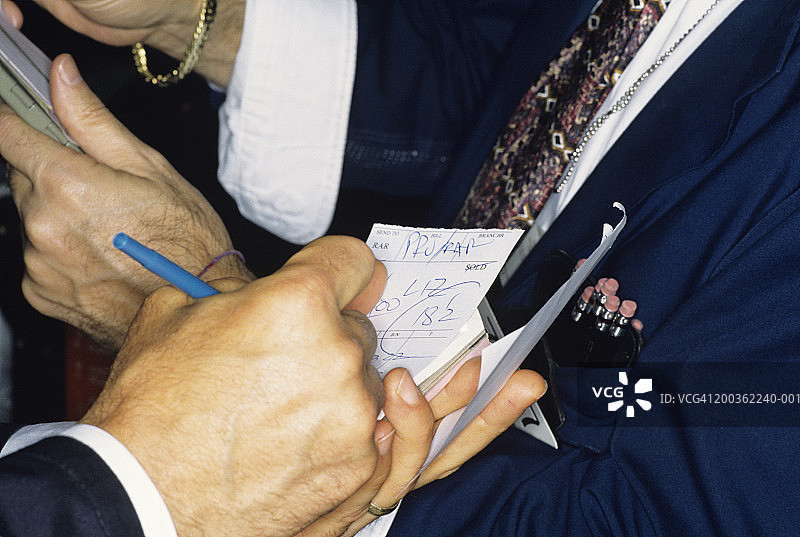 纽约证券交易所交易员手部特写图片素材