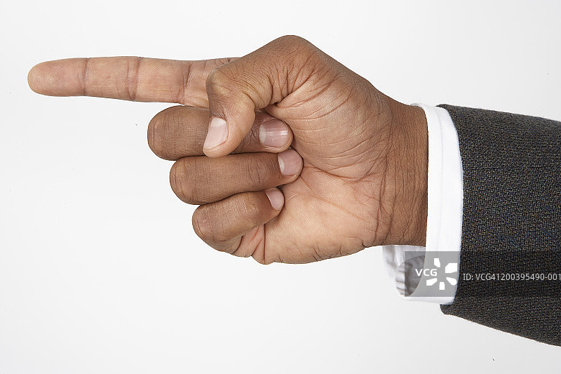 指向前方的商人（聚焦手部）图片素材