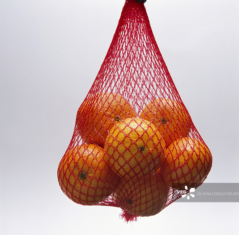 挂在网兜里的橘子图片素材