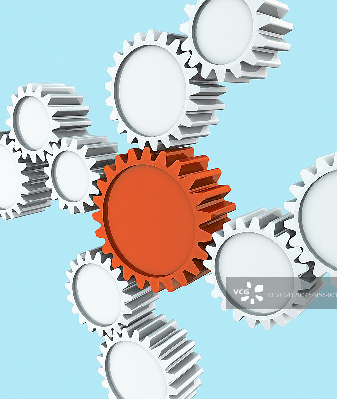 连接到更大橙色齿轮的齿轮特写图片素材