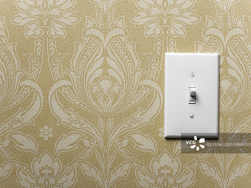 米色壁纸墙上的照明开关特写图片素材