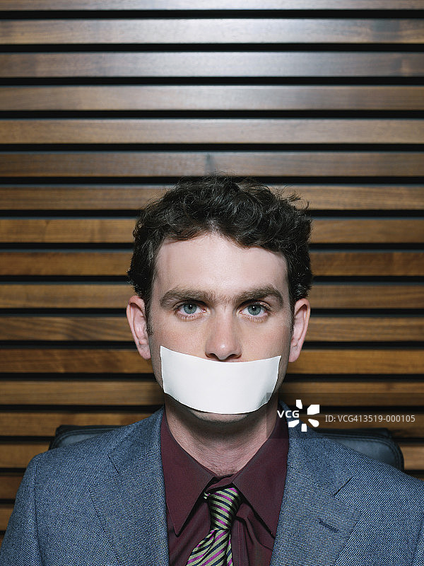 被堵嘴的男商人图片素材