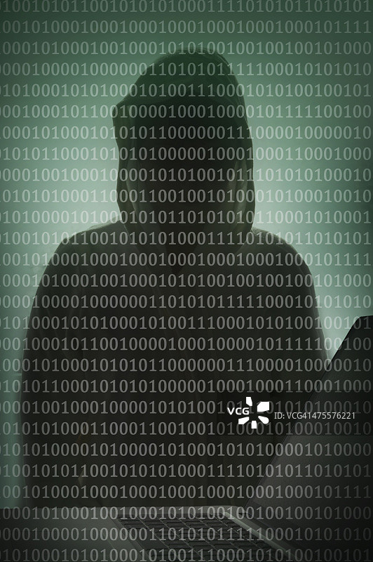 二进制代码与笔记本电脑上的黑客图片素材