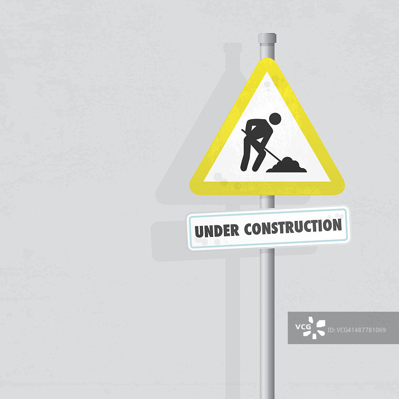 带有纹理墙面的施工标志图片素材