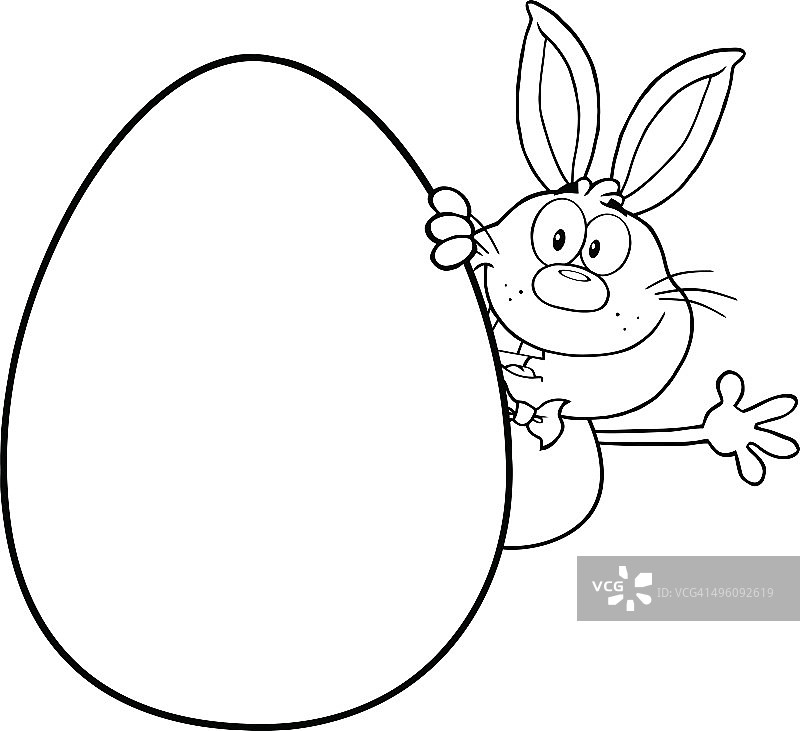 复活节彩蛋后挥手的黑白兔子图片素材