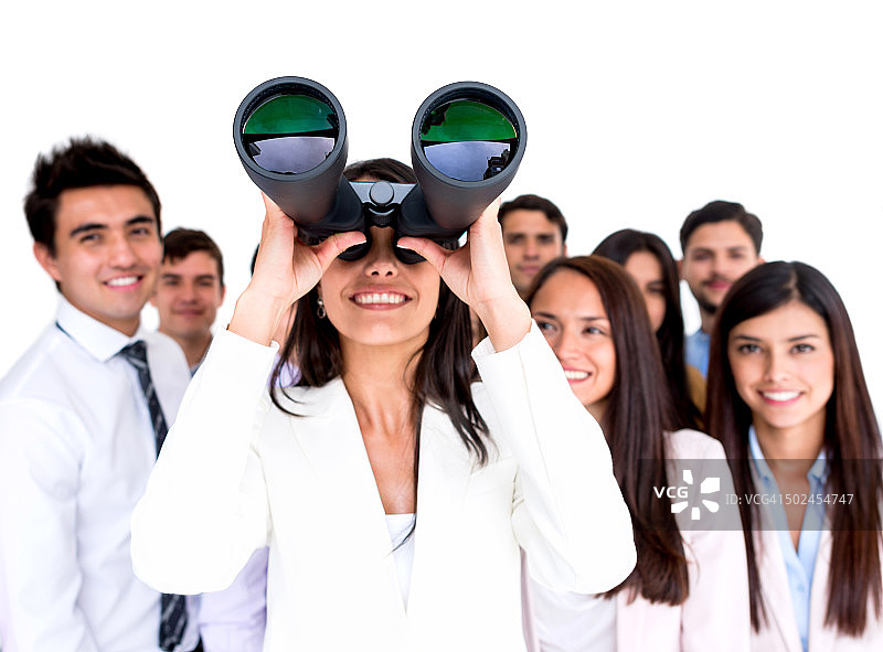 拿着双筒望远镜的女商人图片素材