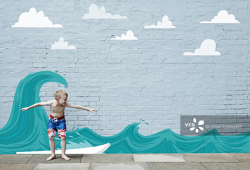 男孩在卡通海浪上冲浪图片素材