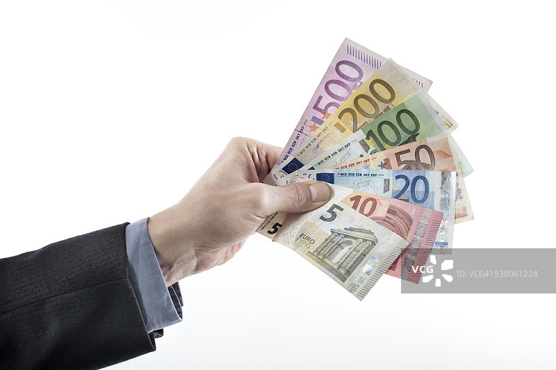 商人展示欧元纸币，德国巴伐利亚图片素材
