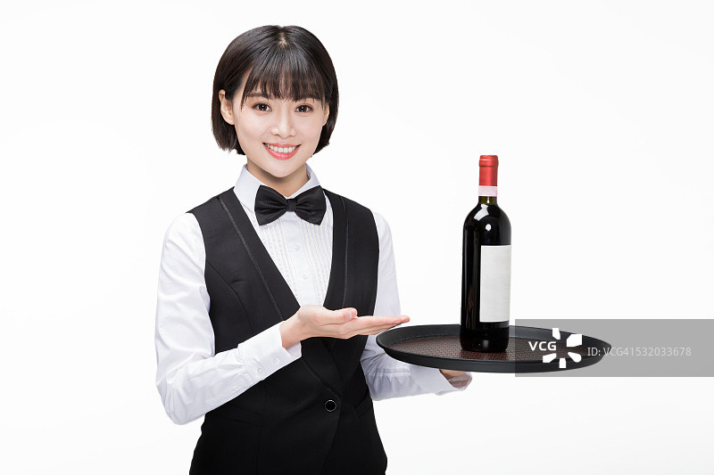 手拿一瓶葡萄酒的女孩图片素材
