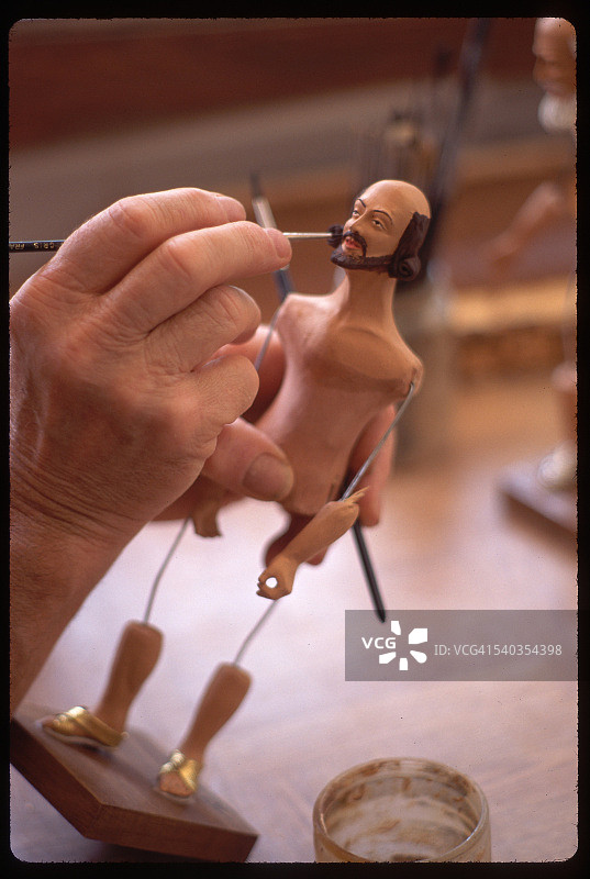 泥塑人偶绘画图片素材