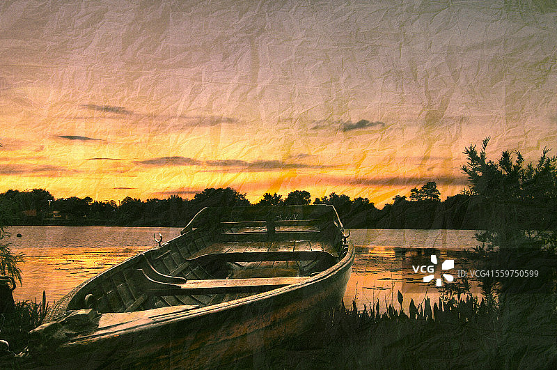 佛罗里达州基西米湖上日落时的划艇图片素材