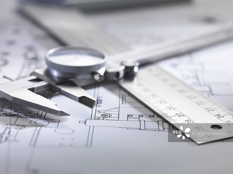设计图纸上的工程测量绘图设备图片素材